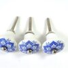 3 blauw/witte knoppen