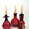 3 roze flesjes + kaarshouders
