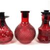 3 roze flesjes + kaarshouders