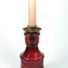 Roze flesje met kaarshouder