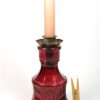 Roze flesje met kaarshouder