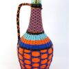 Vintage wijnfles in geweven plastic / wicker bottle