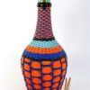 Vintage wijnfles in geweven plastic / wicker bottle