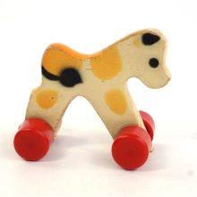 Vintage mini hond op wielen